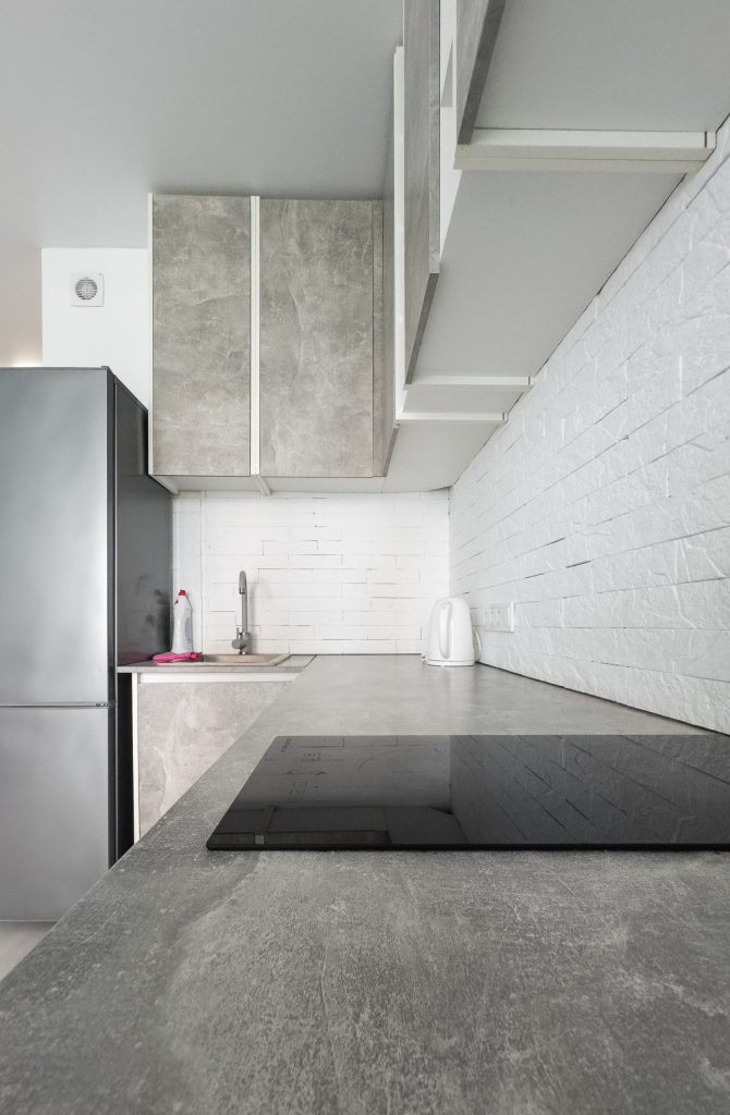 modern bright kitchen Studio with furniture in a new house for a family. High quality photo
